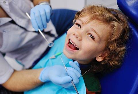 kid at dentist chair
